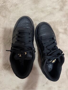 Nike Black Low-Top Sneakers with Gold Accents